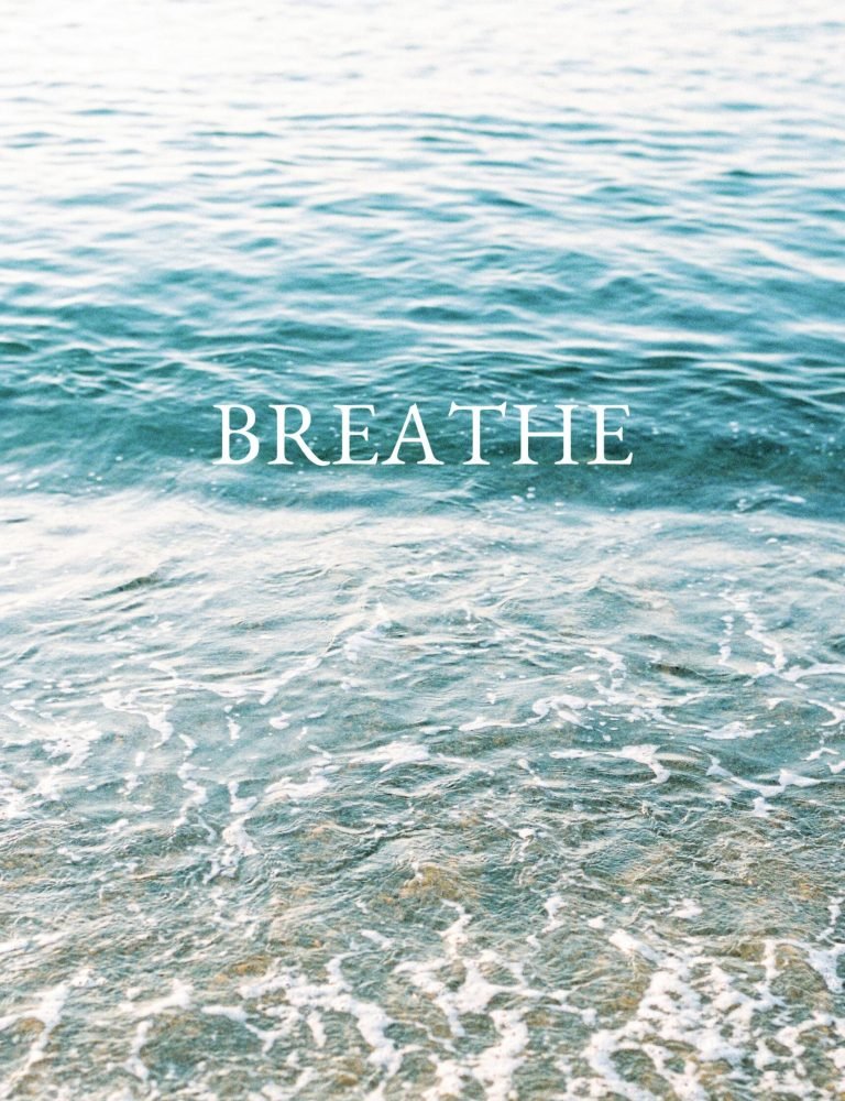 Serene ocean waves with 'Breathe' text inspire calm and reflection.